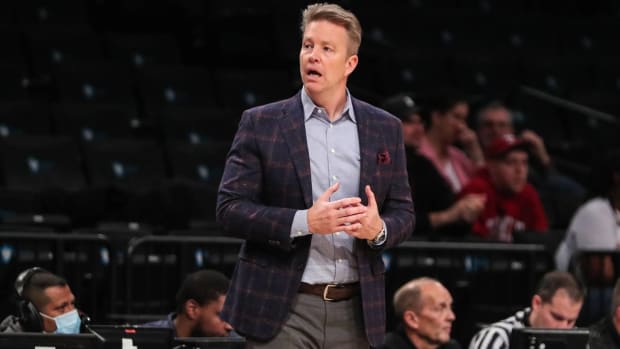 Richmond basketball head coach Chris Mooney reacts to a call during a game.